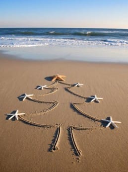 Christmas tree drawn in sand
